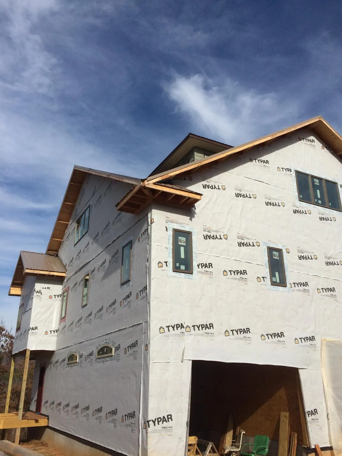 Stick built house wrapped in Typar with new roof framing and dormers in Guilford
